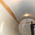 Strider cleaning the inside of a fermenting tank at the SPB 